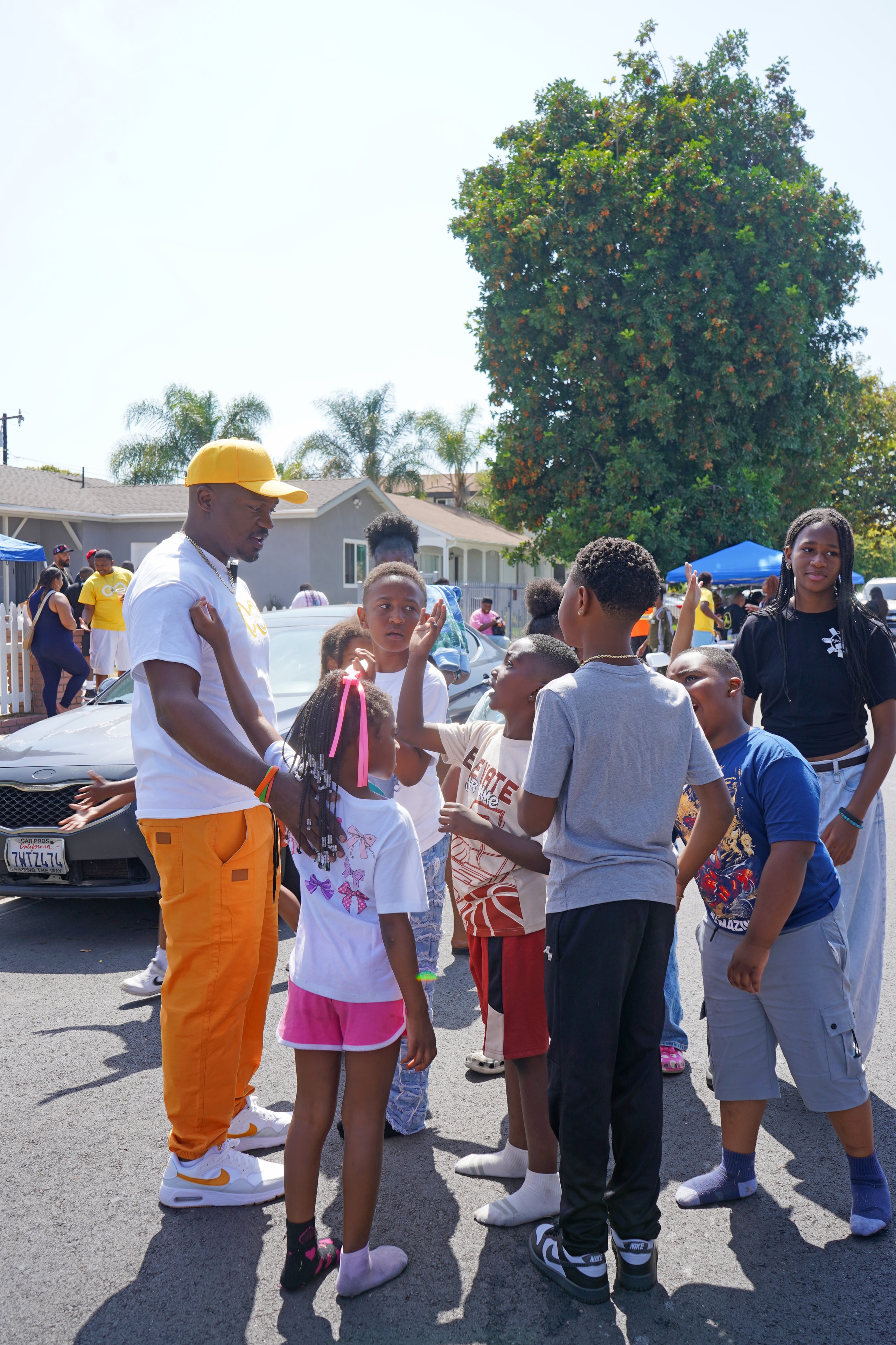 Dee Stallworth with youth at Compton Field Day