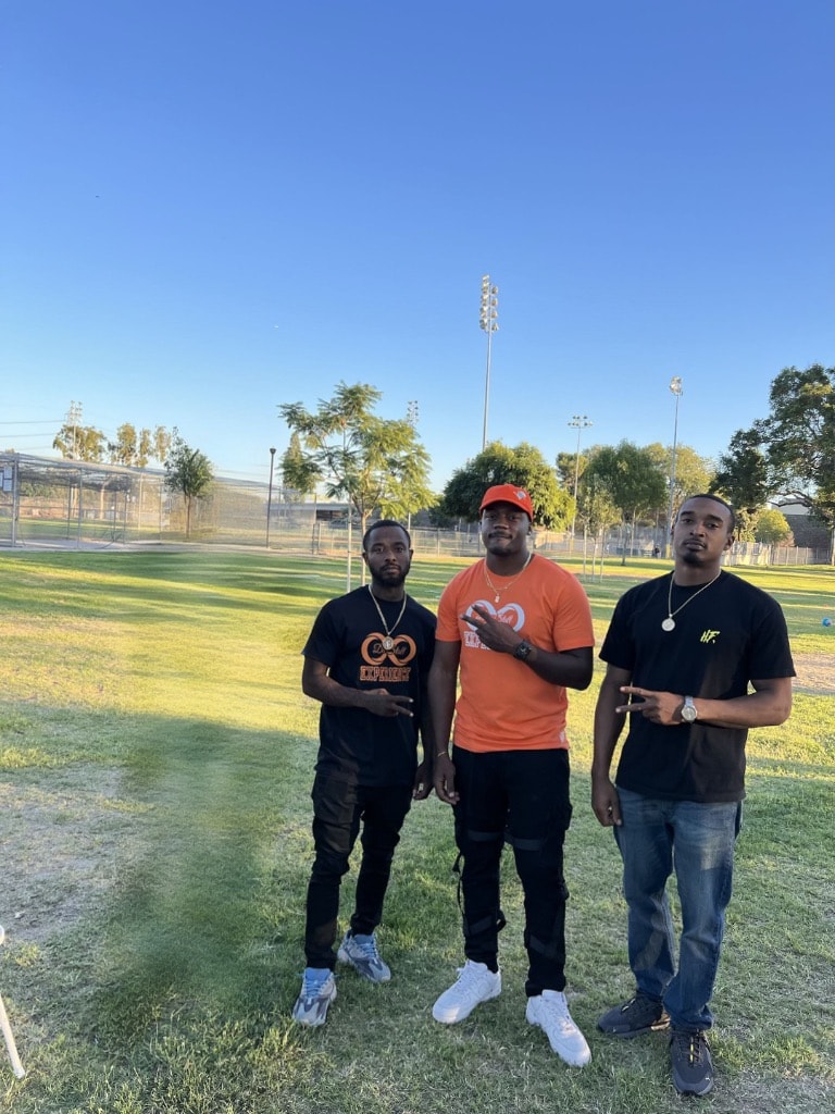 Three DSE team members at a community field event