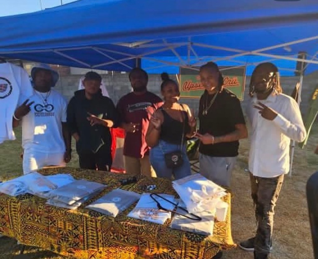DSE team at the merch tent during a community event